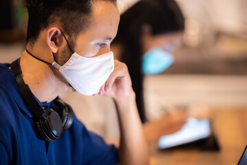 creative worker team wearing face mask, working at business co-working space