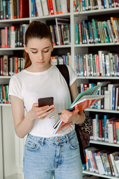 young woman student engaged in library