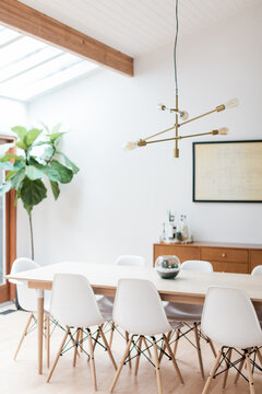 Brass Mid Century Light Fixture in Bright Dining Room