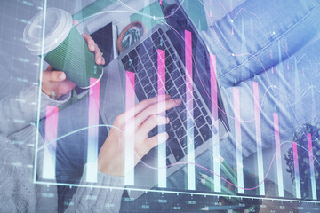Double exposure of woman hands typing on computer and forex chart hologram drawing. Stock market invest concept.