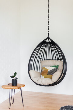 Hanging Chair in Bright, Bohemian Living Room