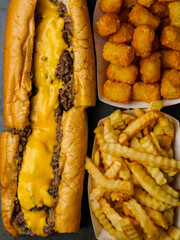 Cheesesteak with French fries and tater tots
