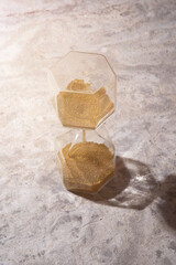 Close up of the hourglass with the sand fall down