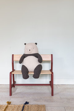 Stuffed Panda Toy Sitting on Bench