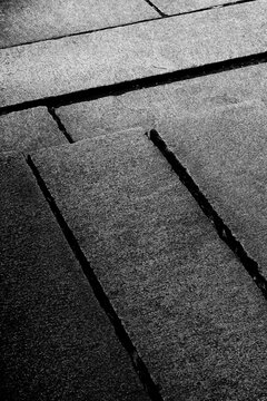 stone step with angled sections in black and white