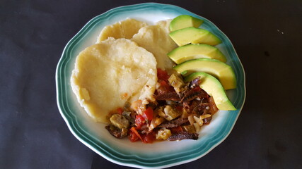 Dumplings, avocadoes and smoked herrings with seasonings 