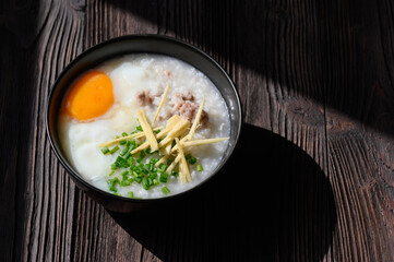Rice gruel or congee with egg ,pork and vegetable