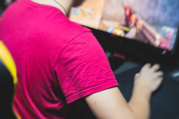 Cyber sport e-sports tournament, team of professional gamers, close-up on gamer's hands on a keyboard, pushing button, gamers playing in competitive moba/strategy fps game on a cyber games arena club