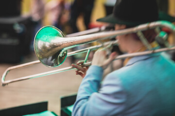 Concert view of a trombone player trombonist with musical jazz band performing