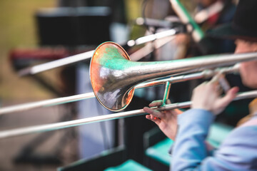 Concert view of a trombone player trombonist with musical jazz band performing