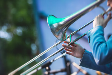 Concert view of a trombone player trombonist with musical jazz band performing