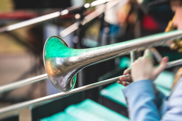 Concert view of a trombone player trombonist with musical jazz band performing