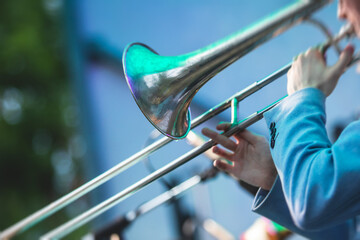 Concert view of a trombone player trombonist with musical jazz band performing