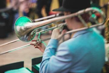 Fototapeta premium Concert view of a trombone player trombonist with musical jazz band performing