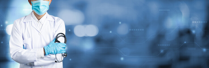 Doctor Man on blur hospital laboratory panoramic blue background. COVID-19 virus epidemic outbreak...