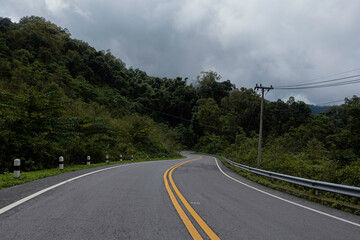 Rural Country Road on the Mountains early in the morning on the Doi Phuka National Reserved Park, Nan Province, Thailand