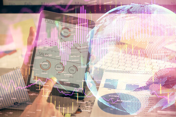 Multi exposure of man's hands holding and using a phone and financial chart drawing. Market analysis concept.