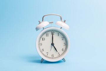 Alarm clock on blue background