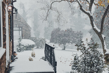 A Snow Covered Entryway to a Large Suburban Home