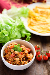 Northern Thai food (Nam Prik Ong), spicy chili minced pork with tomatoes in a bowl eating with omelette, Thai chili paste