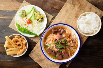 Northern Thai food (Kanom Jeen Nam Ngeaw), Rice noodles spicy soup with pork and pork blood eating with fresh vegetables and pork rind