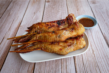 Grilled chicken wings on dish