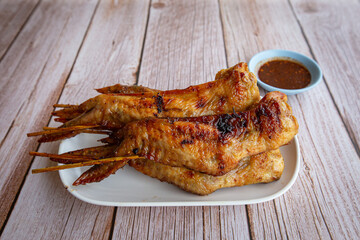 Grilled chicken wings on dish