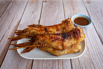 Grilled chicken wings on dish