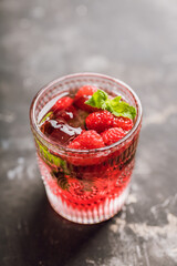 Old fashioned raspberry cocktail. Selective focus. Shallow depth of field.
