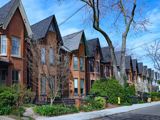 Street of gentrified old semi-detached houses with gables