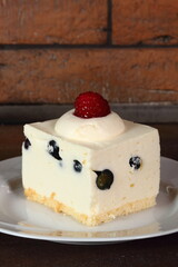Frozen cheesecake with blueberry and raspberry
