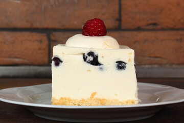 Frozen cheesecake with blueberry and raspberry