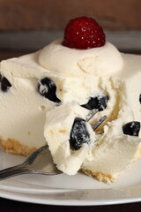Frozen cheesecake with blueberry and raspberry