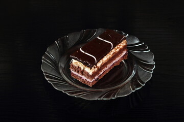 Layer cake with fruit and cream fillings decorated chocolate icing