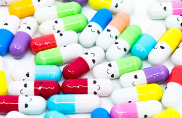 Smiling face colorful capsules. The concept of orphan drugs, medicine against rare diseases.