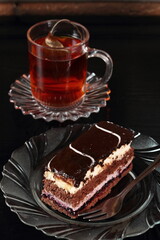 Layer cake with fruit and cream fillings decorated chocolate icing