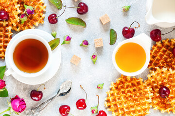 Tea, honey, cherry, milk and wafers.