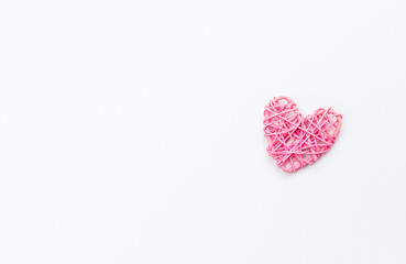 Pink wooden heart design on white background, love and romance symbol, valentine card concept