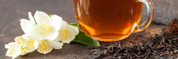 Naklejka na ściany i meble Cup of tea with jasmine flowers