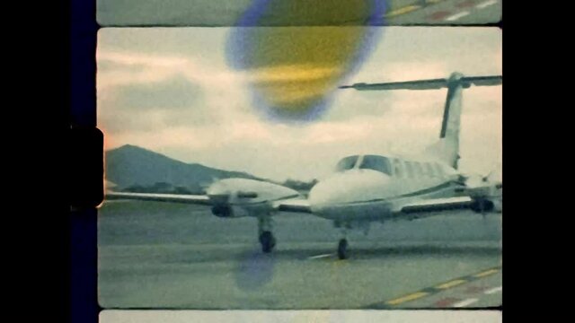 Real Vintage Super-8 Footage of a Bimotor Airplane in the Airport Runway. Shoot in Kodak Vision3 T500.