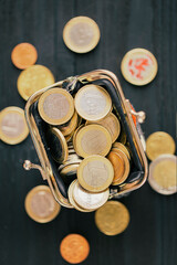 Euro coins in a wallet, top view. concept of small money, the financial crisis, the consequences of quarantine Covid-19.