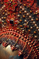 Head of woman mannequin in red decorated head wear, black studio background