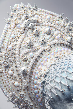 Head of mannequin in creative white kokoshnick with jewels and pearls
