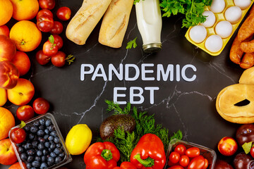 Pandemic food benefits program. Fruits and vegetables on black background.