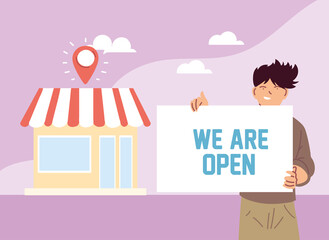 man at his local business with open banner