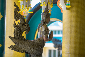 Blurred abstract background of sculptures seen at temples or religious tourist sites (Phaya Nak,...