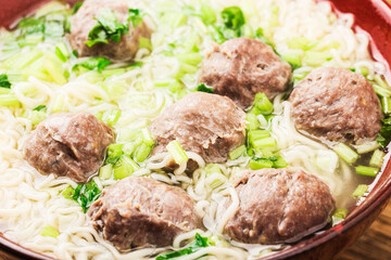 Chinese Food：Meatballs served with noodles,