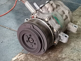this is an image of used car air-conditioner compressor 
