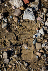 Footprint in sand & rock