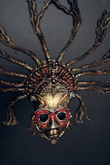 Creative african mask, dark studio background